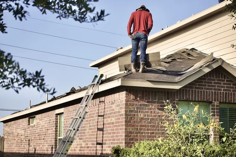 Professional roofer working on a residential roof in Chimney Hill Estates